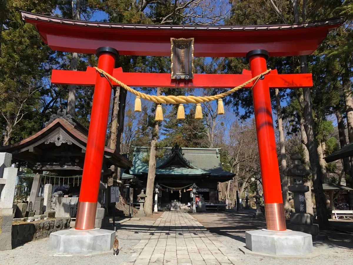 Torii gate and hall of a Fuji Sengen shrine in Fujiyoshida on a Mt Fuji sightseeing day trip from Tokyo