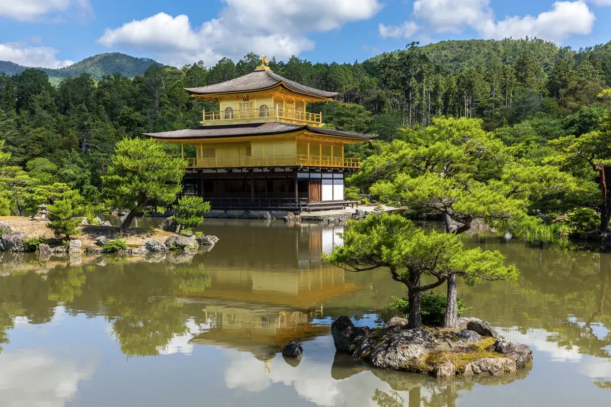 Kinkaku-ji Golden Pavilion reflected in its pond in Kyoto on a three-day day trip from Tokyo